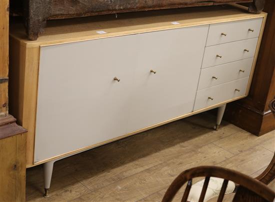 A 1960s Hilles beech and composition veneered sideboard W.183cm